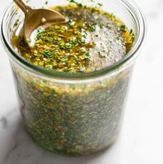 jar of prepared chermoula with a spoon